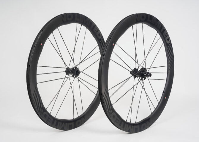 Pair of black bicycle wheels on a white background
