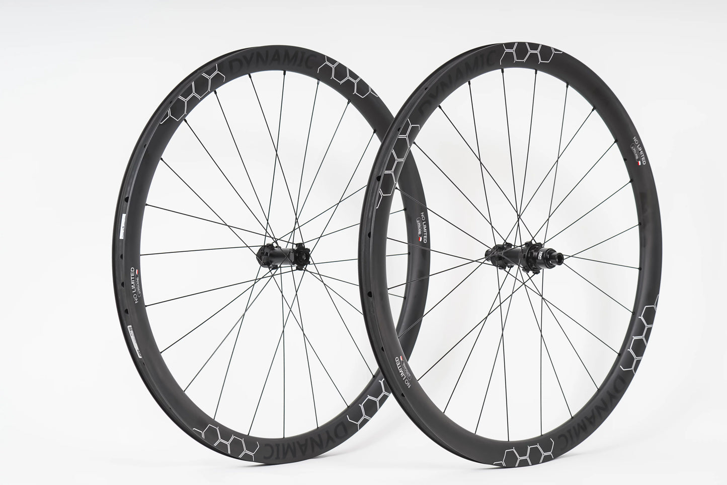 Pair of black bicycle wheels with a white background