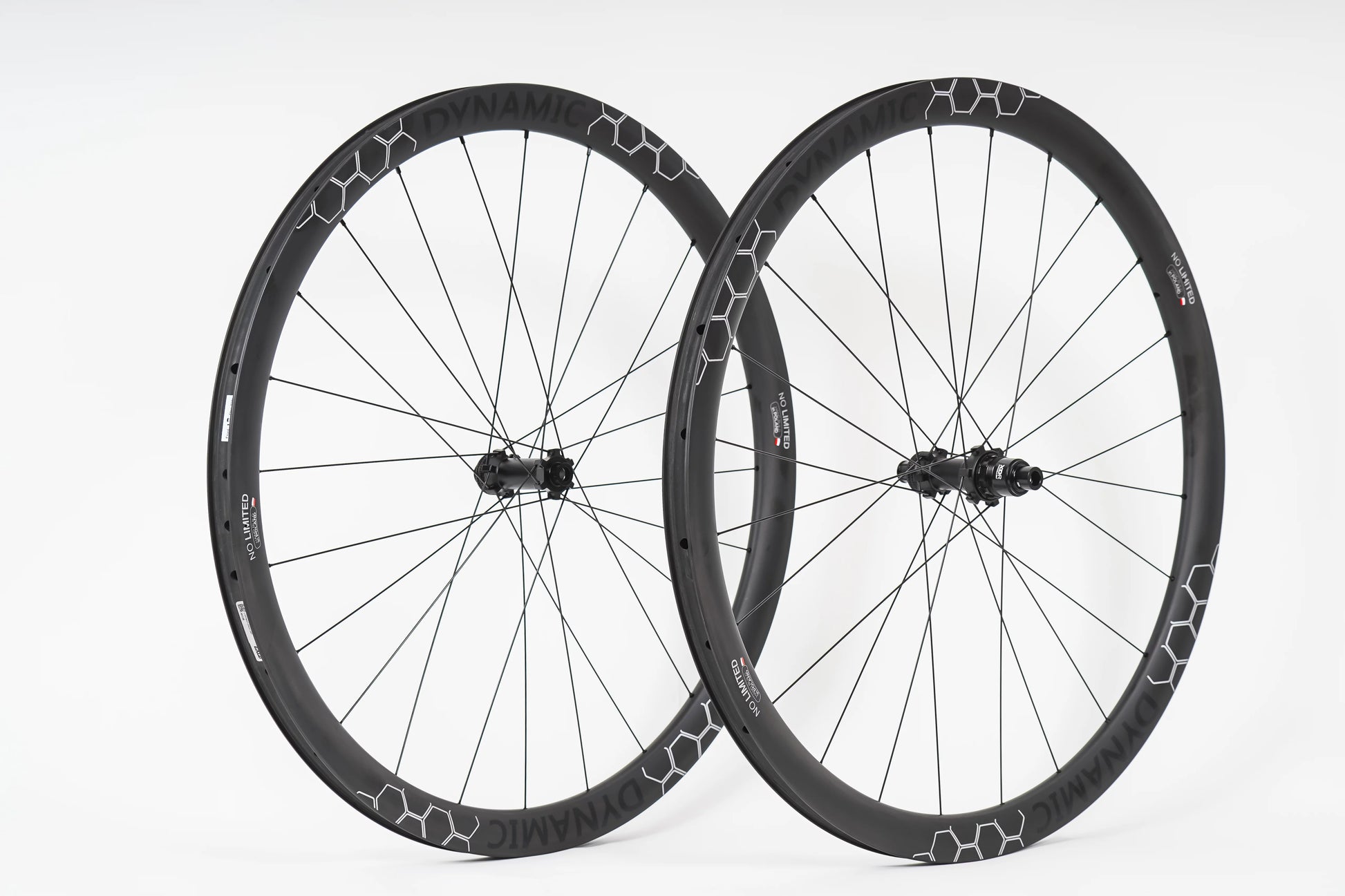 Pair of black bicycle wheels with a white background