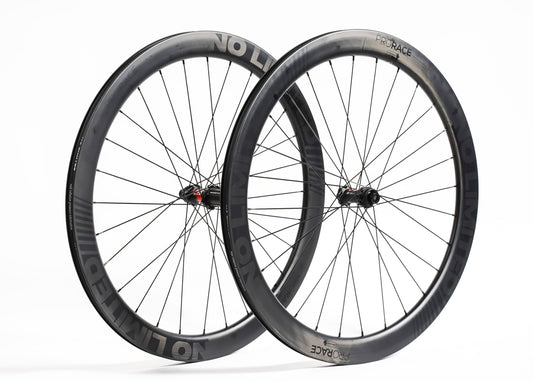 Two bicycle wheels with No-Limited branding on a white background