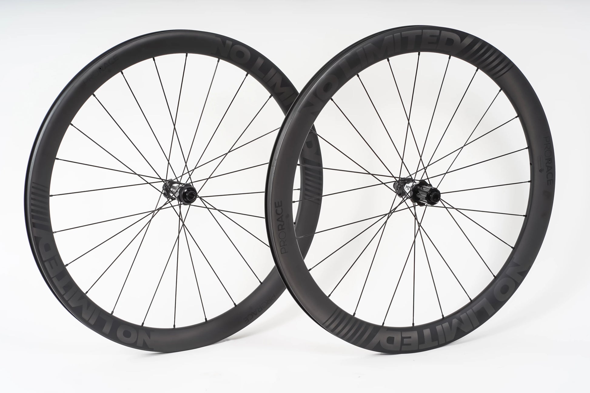 Two bicycle wheels on a white background