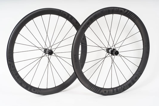 Two bicycle wheels on a white background