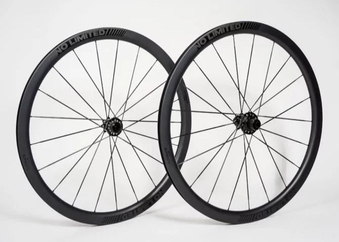 Two black bicycle wheels with 'No-Limited' branding on a white background