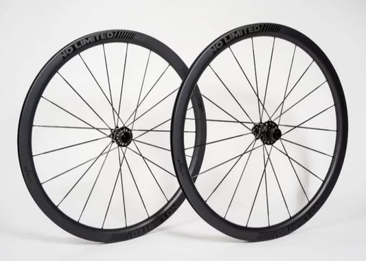 Two black bicycle wheels with 'No-Limited' branding on a white background