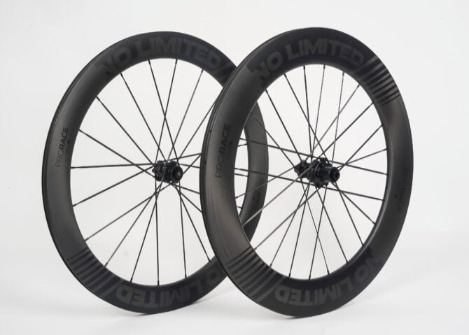 Two bicycle wheels with 'No Limited' branding on a white background