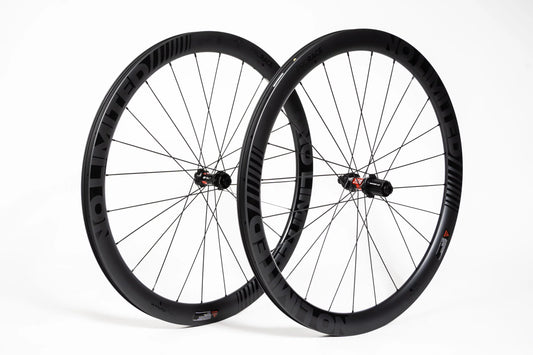 Pair of black bicycle wheels on a white background