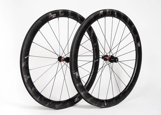 Pair of black bicycle wheels on a white background