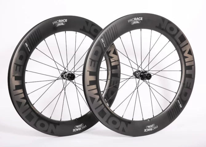 Two bicycle wheels with 'Pro Race' and 'Velolimit' branding on a white background