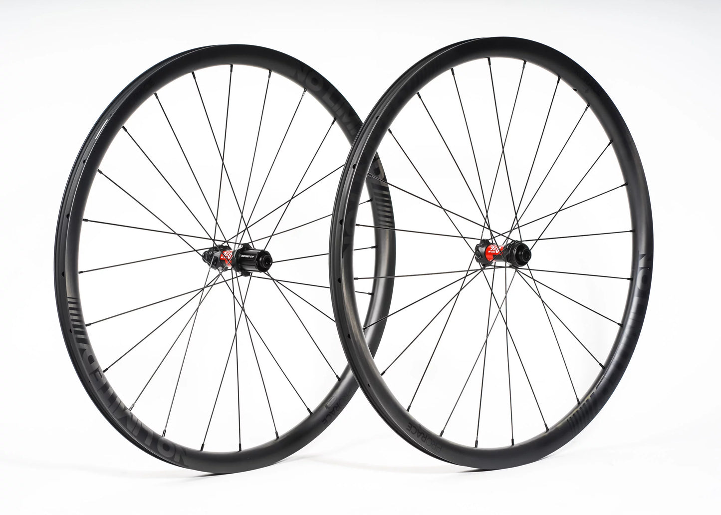 Two bicycle wheels on a white background