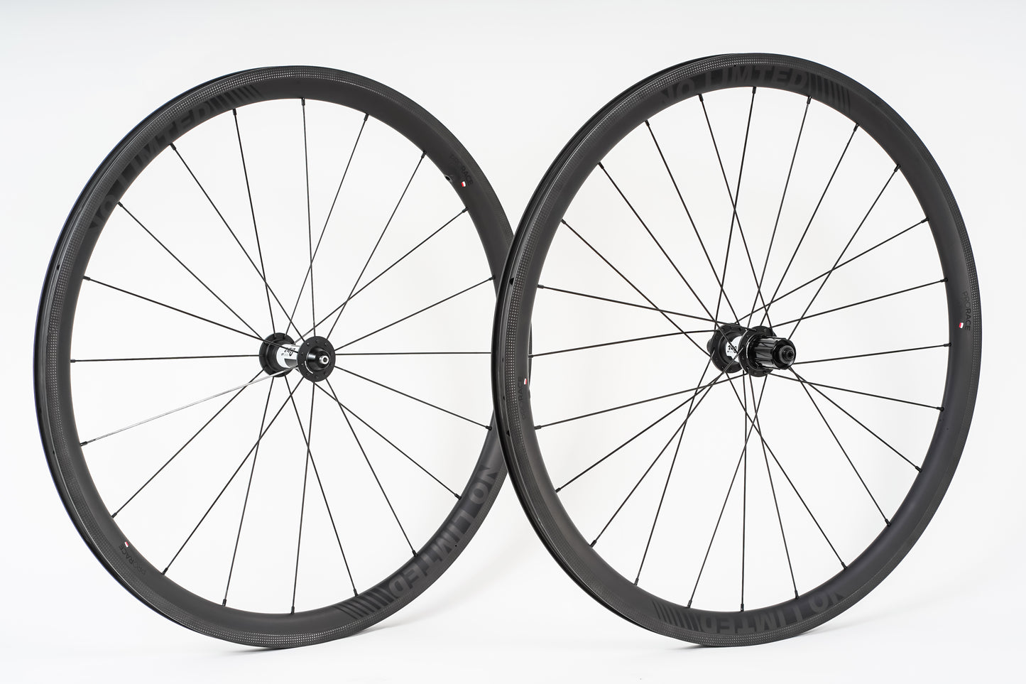 Two bicycle wheels on a white background. No Limited Pro Race 38, rims.