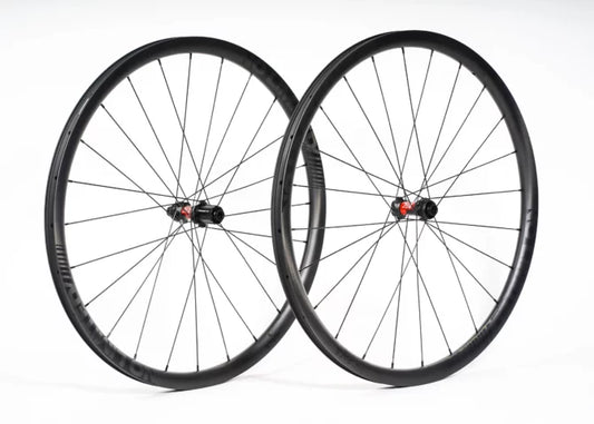 Two bicycle wheels on a white background